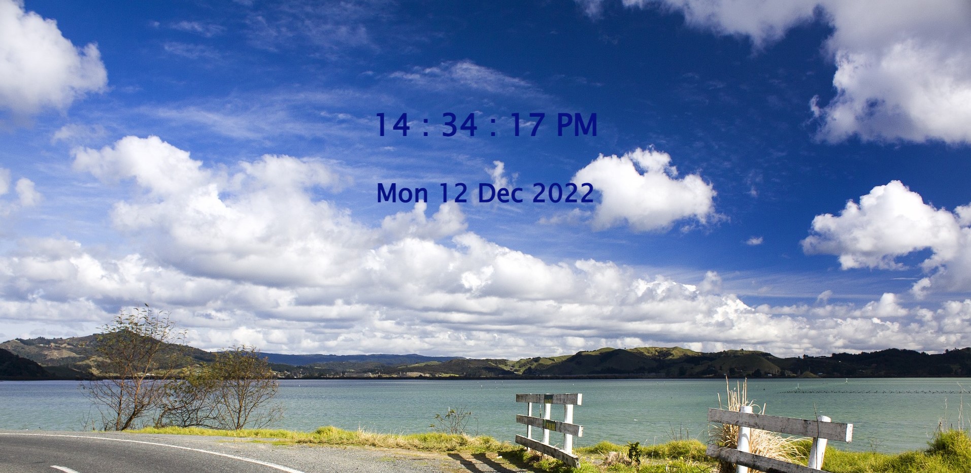 Digital clock showing time, date in the middle of the screen and background picture